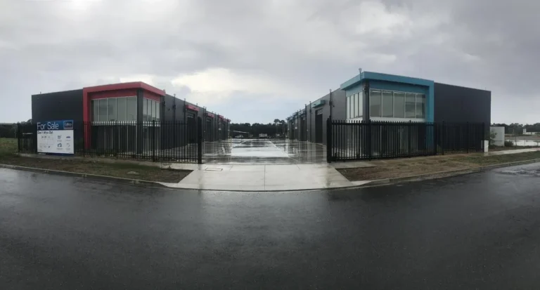 Commercial buildings for sale on rainy day.
