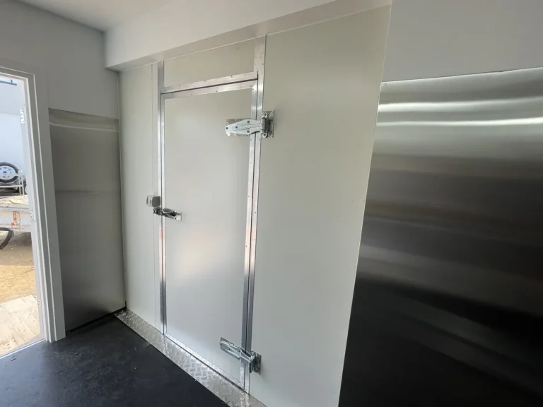 Modern industrial walk-in freezer door in commercial kitchen