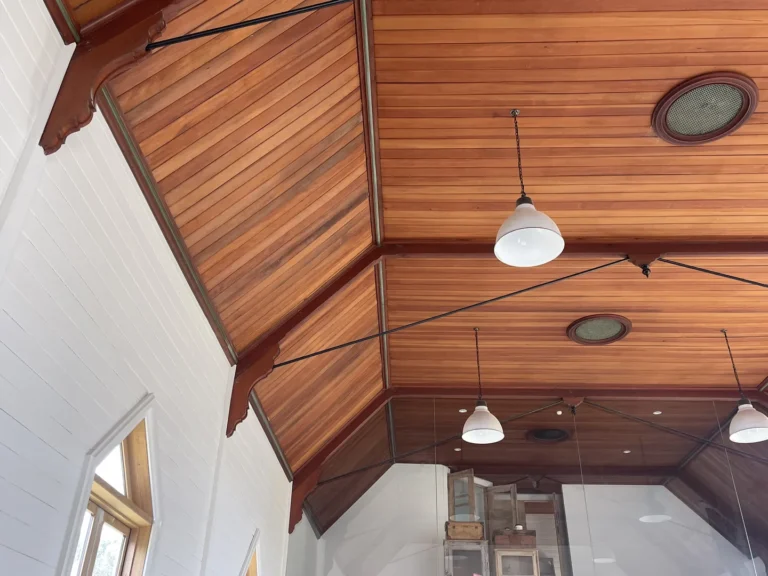 Interior view of wooden ceiling with pendant lights.